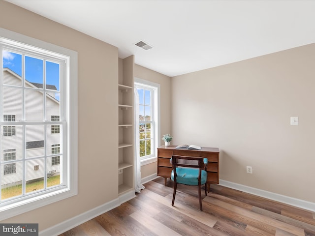 office area with hardwood / wood-style flooring