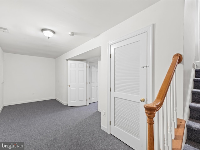 basement with dark colored carpet