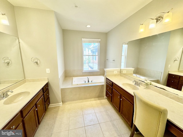 bathroom with vanity, tiled bath, and tile patterned floors