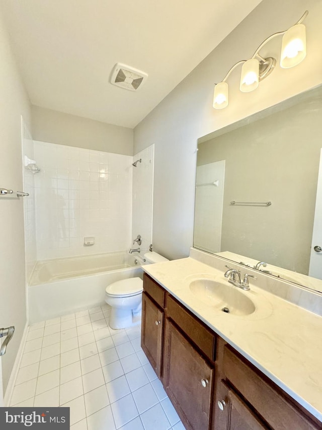 full bathroom with vanity, toilet, tile patterned floors, and tiled shower / bath