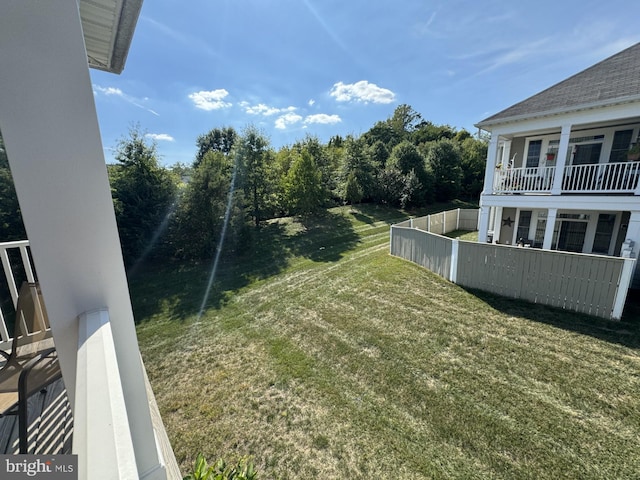 view of yard with a balcony