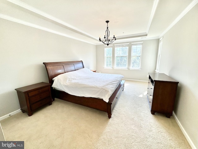 bedroom with a tray ceiling, a notable chandelier, crown molding, and light carpet