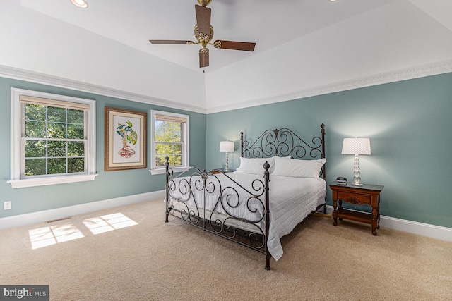 carpeted bedroom with multiple windows and ceiling fan