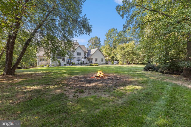 exterior space with an outdoor fire pit