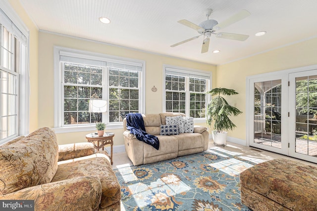 sunroom with ceiling fan and a wealth of natural light