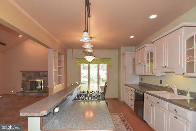 kitchen with white cabinets, sink, stainless steel gas cooktop, decorative light fixtures, and dishwasher