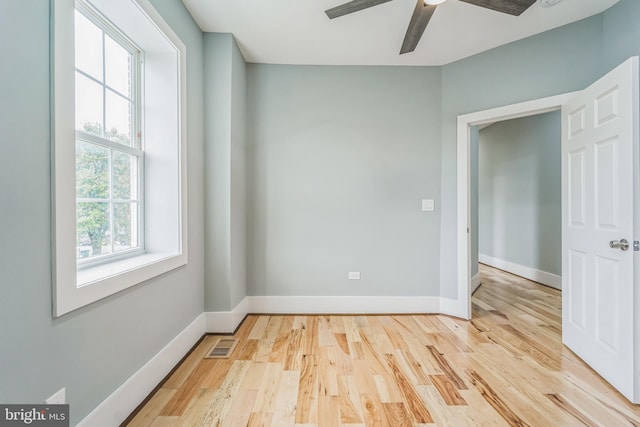 unfurnished room with ceiling fan and light hardwood / wood-style floors