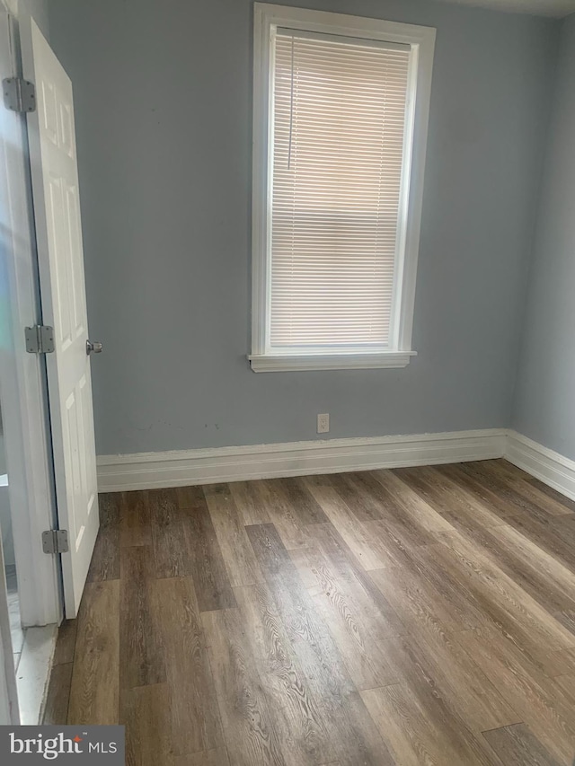 empty room featuring dark hardwood / wood-style floors