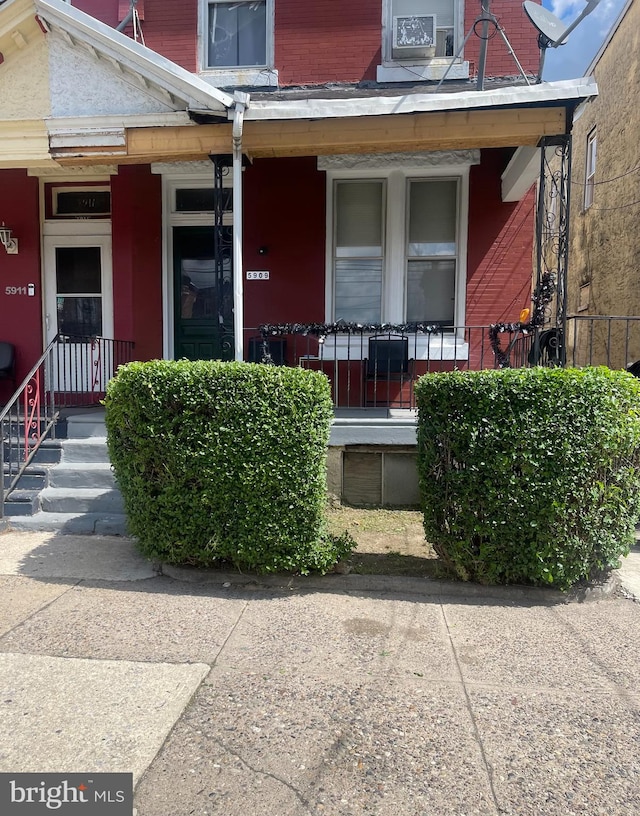 doorway to property featuring covered porch