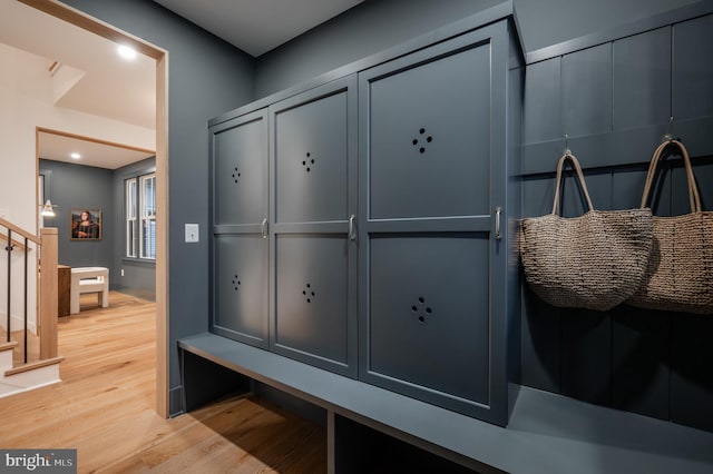 mudroom with light hardwood / wood-style floors