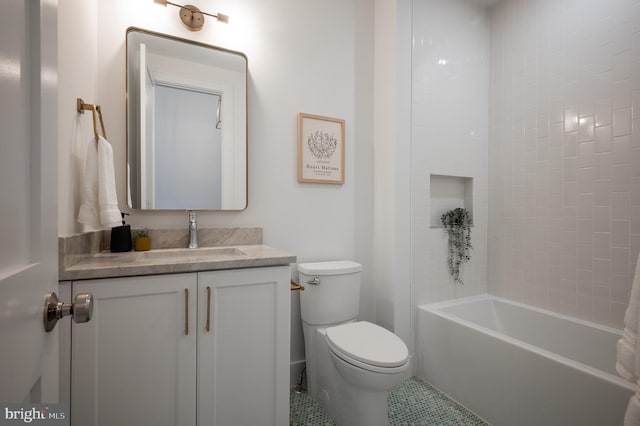 full bathroom with tiled shower / bath, vanity, tile patterned flooring, and toilet