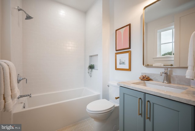 full bathroom featuring vanity, tiled shower / bath combo, toilet, and tile patterned floors