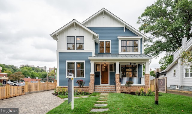 view of front of home featuring a front lawn and covered porch