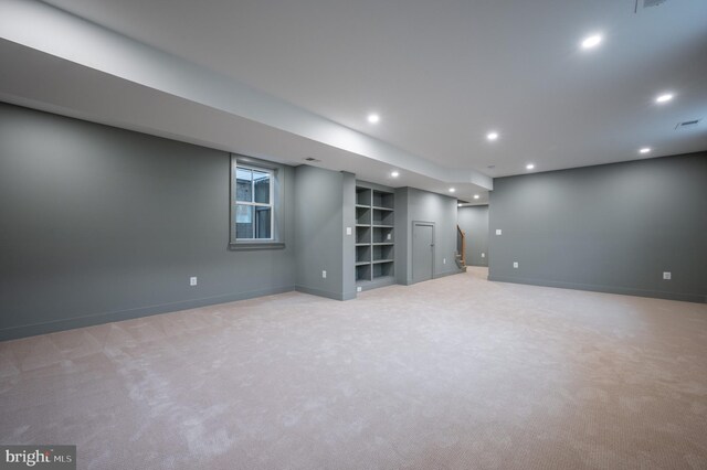 basement with light colored carpet