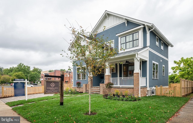 craftsman-style home featuring a front yard and a porch