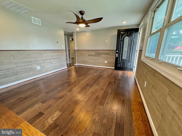 unfurnished room with ceiling fan and wood-type flooring