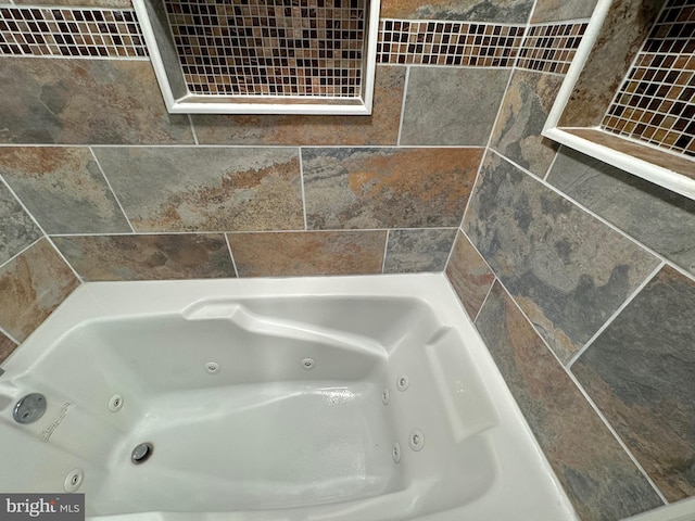 bathroom with a tub to relax in