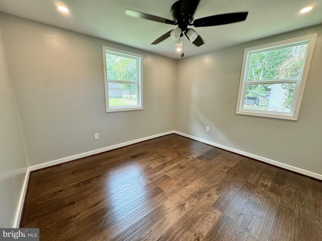 unfurnished room with ceiling fan and hardwood / wood-style flooring