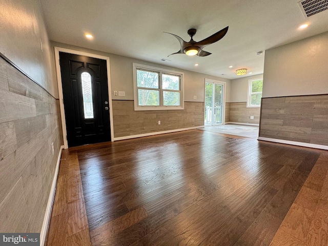 foyer entrance with hardwood / wood-style floors and ceiling fan