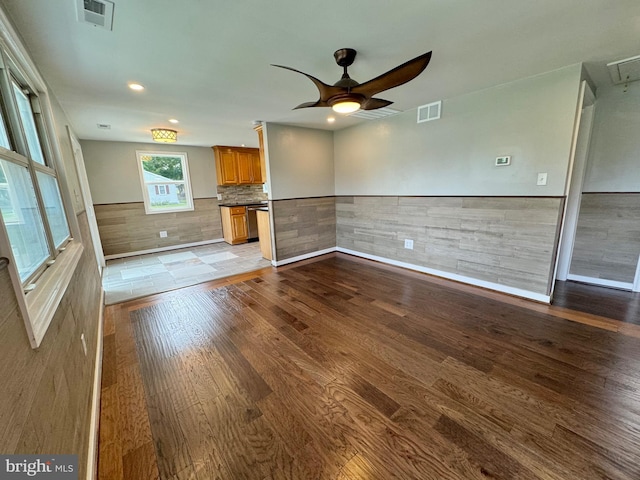 spare room featuring ceiling fan and light hardwood / wood-style floors