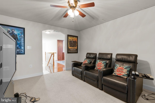 cinema featuring light carpet and ceiling fan