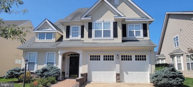 view of front of property with a garage