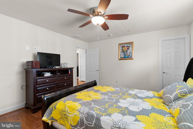 bedroom with wood-type flooring and ceiling fan