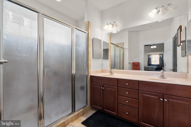 bathroom with vanity, tile patterned floors, and a shower with shower door