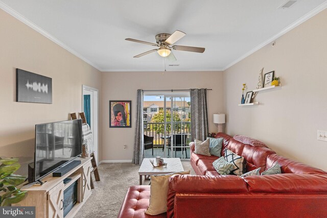 carpeted living room featuring crown molding and ceiling fan