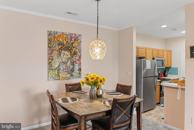 dining room with ornamental molding