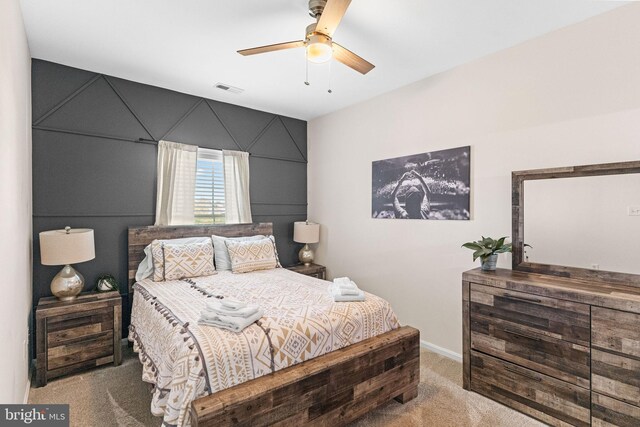 bedroom featuring ceiling fan and carpet flooring