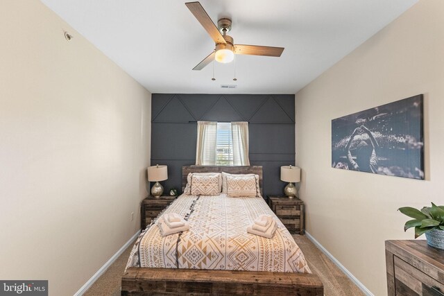 carpeted bedroom with ceiling fan