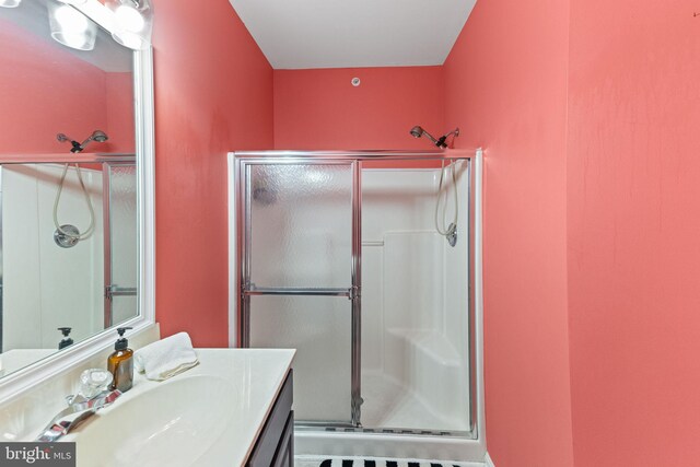 bathroom featuring vanity and walk in shower