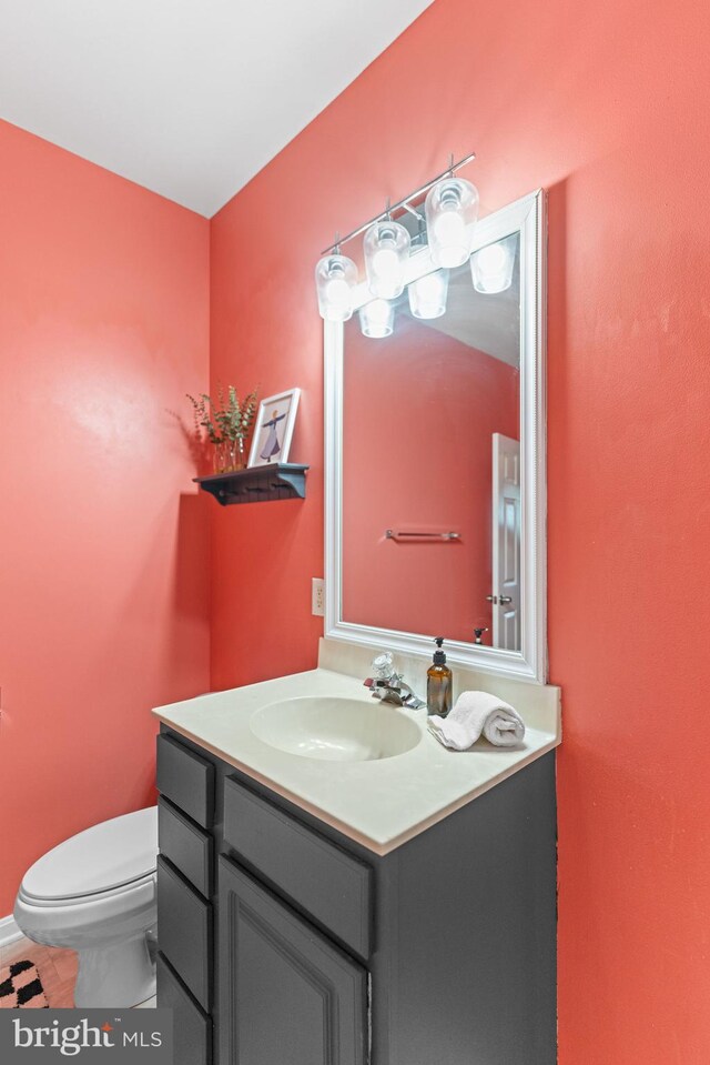 bathroom with toilet and vanity