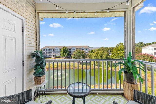 balcony featuring a water view