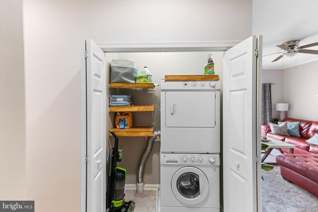 washroom featuring ceiling fan and stacked washing maching and dryer