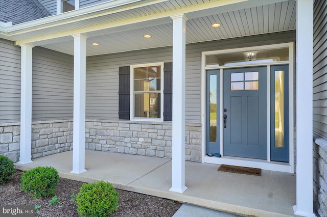 property entrance with covered porch