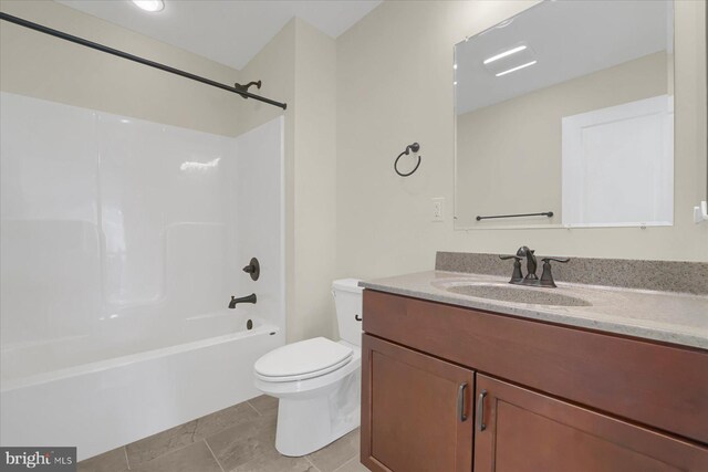 full bathroom with vanity, toilet, tile patterned flooring, and shower / washtub combination