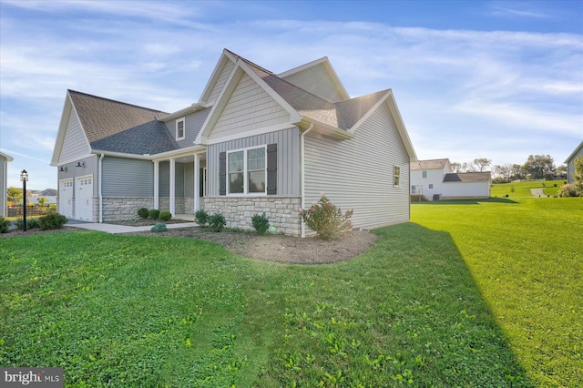 83 Landon Dr, Bellefonte, PA 16823 - view of side of home featuring board and batten siding, a shingled roof, a lawn, stone siding, and an attached garage