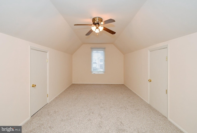 bonus room with light colored carpet, ceiling fan, and lofted ceiling