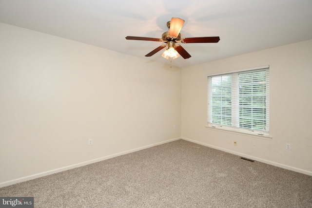 carpeted empty room with ceiling fan