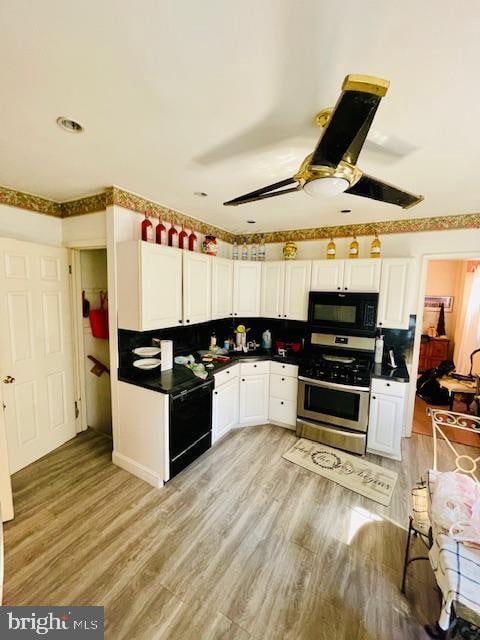 kitchen with black appliances, backsplash, light hardwood / wood-style floors, white cabinetry, and ceiling fan