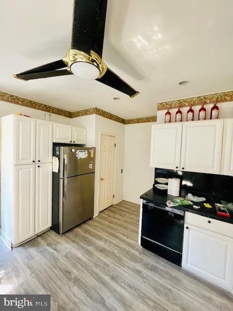 kitchen with black dishwasher, light hardwood / wood-style floors, stainless steel refrigerator, white cabinetry, and ceiling fan