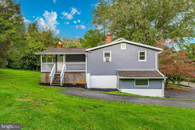 view of front of house with a front lawn and a porch