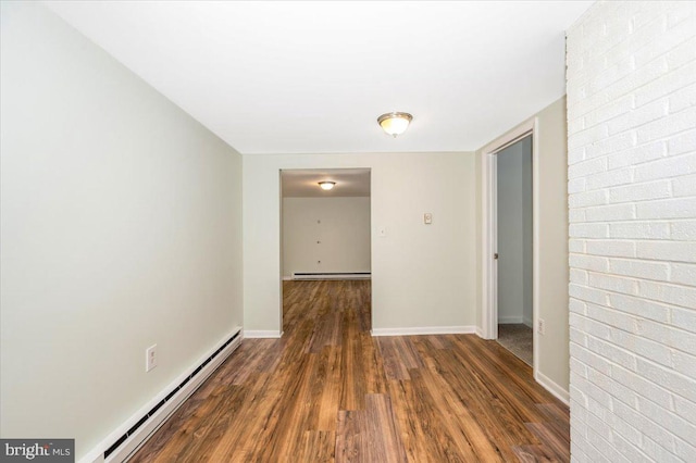 corridor featuring a baseboard radiator and dark wood-type flooring