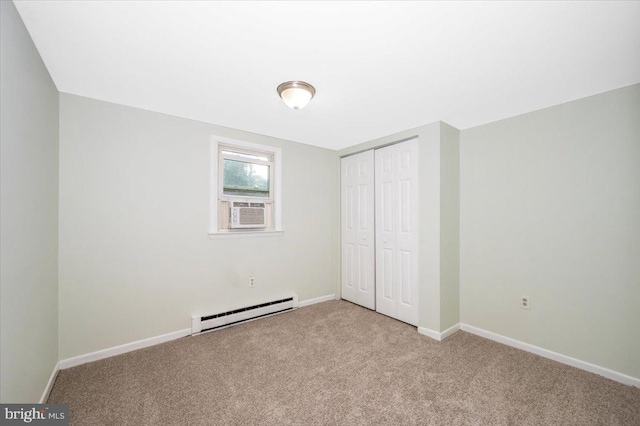 unfurnished bedroom with light carpet, cooling unit, a closet, and baseboard heating