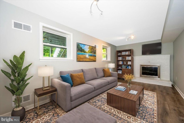 living room with dark hardwood / wood-style floors