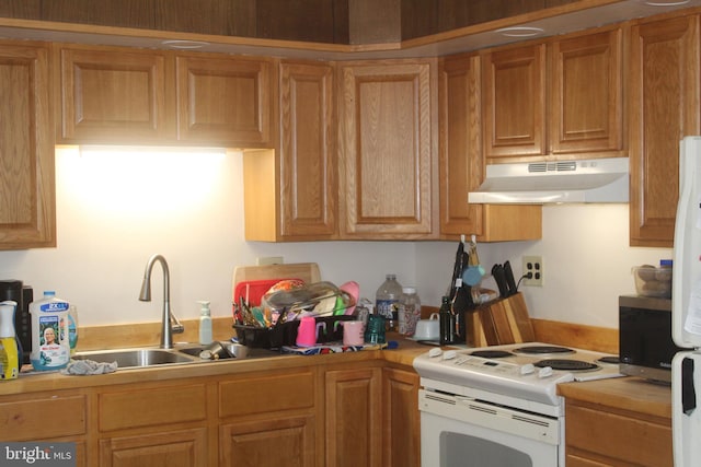 kitchen featuring sink and white range with electric stovetop