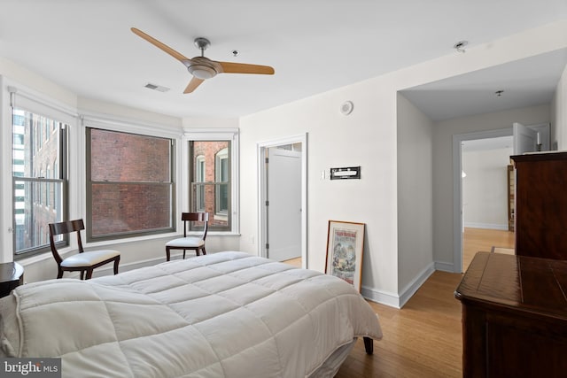 bedroom featuring light hardwood / wood-style floors and ceiling fan