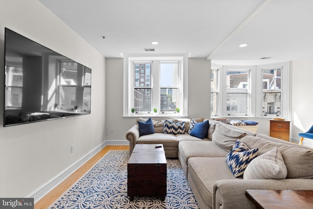 living room with light hardwood / wood-style flooring